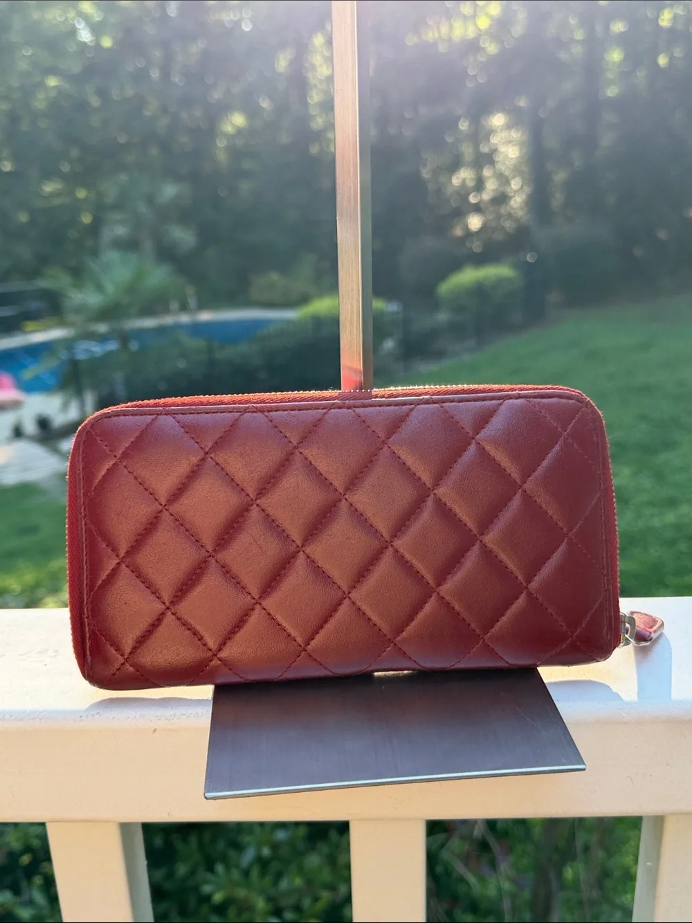 CHANEL Authenticated Quilted Caviar Leather Zip-Around Wallet in Burgundy/red